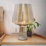 Tapered Table Lighting Nordic Cement Single Study Room Nightstand Lamp with Wineglass-Like Amber Glass Shade