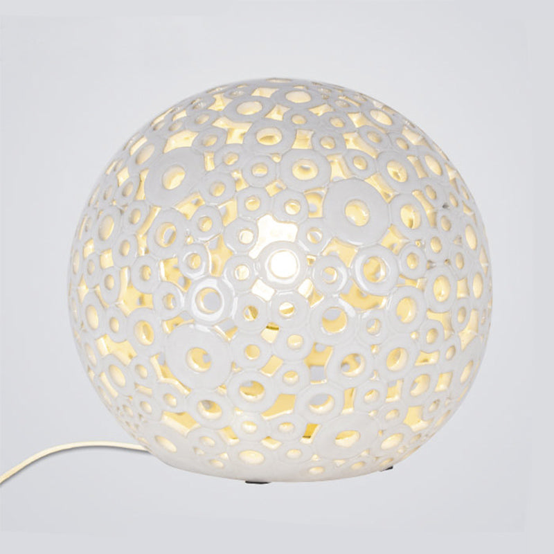 White Hollow-Out Globe Table Light Modernism 1-Head Ceramics Night Lamp for Bedroom