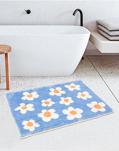 White Flower with Blue Ground Bath Mat