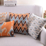 The Clementine + Teal Ikat Pillow Cover Collection