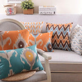 The Clementine + Teal Ikat Pillow Cover Collection