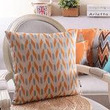 The Clementine + Teal Ikat Pillow Cover Collection