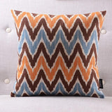 The Clementine + Teal Ikat Pillow Cover Collection