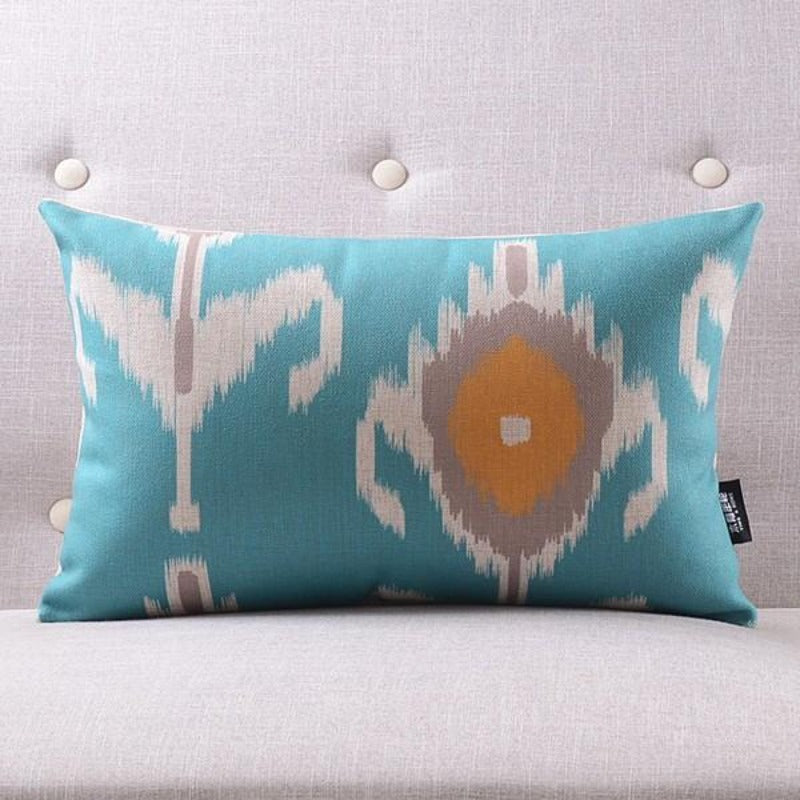 The Clementine + Teal Ikat Pillow Cover Collection