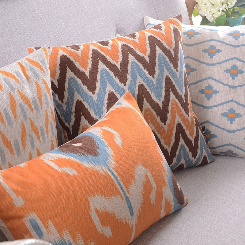 The Clementine + Teal Ikat Pillow Cover Collection