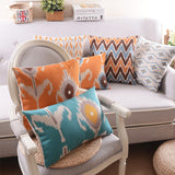 The Clementine + Teal Ikat Pillow Cover Collection