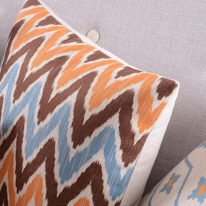 The Clementine + Teal Ikat Pillow Cover Collection